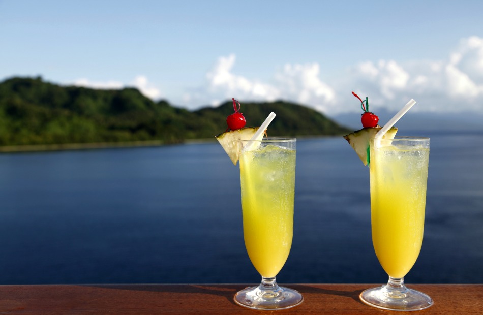 Double Cocktails with Tropical Island in background