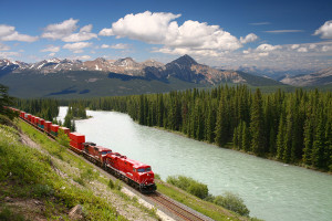 Freight train moving along river
