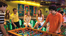 Teenagers playing table football