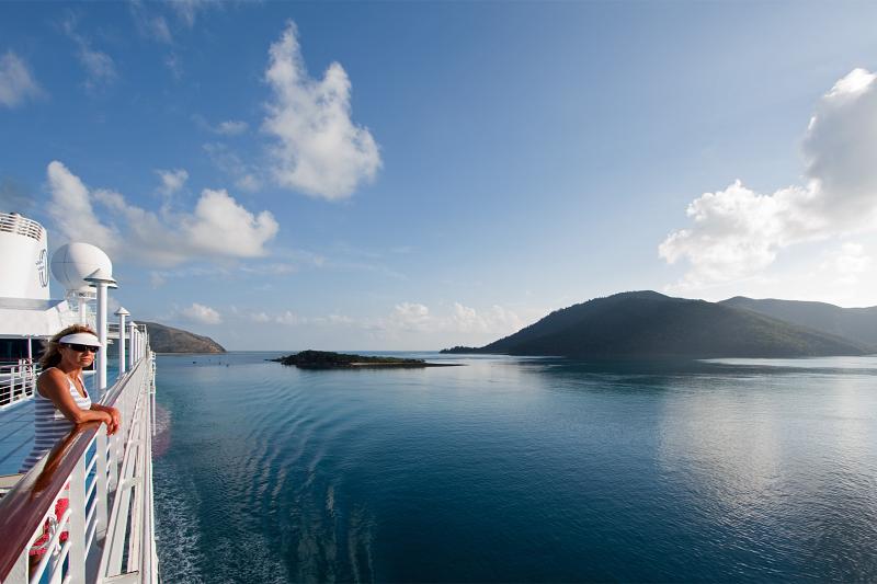 Nautica cruising through the Whitsunday Islands before breakfast: January 2010