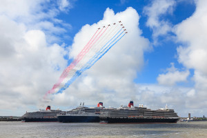 Liverpool, England - May 25, 2015:  The Three Queens, Elizabeth, Victoria and Mary pictured on the River Mersey and saluted by the Red Arrows in celebration of Cunard's 175th anniversary.