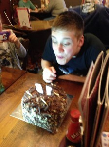 Connor blowing out candles