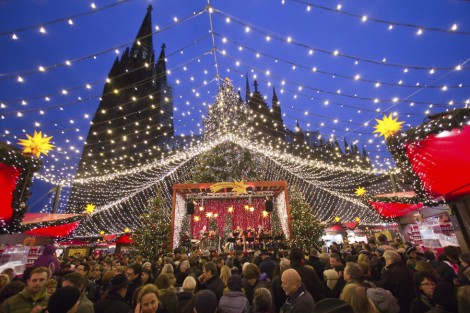COLOGNE, GERMANY - DECEMBER 23: People enjoy the Christmas market in front of the Cologne cathedral on December 23, 2012 in Cologne, Germany.