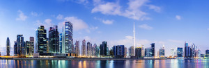 Panoramic view of the futuristic downtown Dubai city skyline at sunset, United Arab Emirates.
