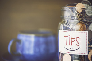 Tip jar in coffee shop or restaurant. American currency